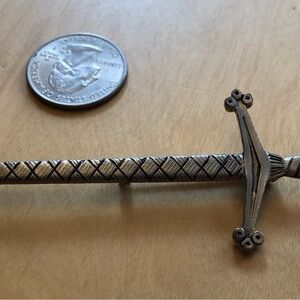 Vintage Silver-Tone Sword Brooch with Crossguard and Textured Blade
